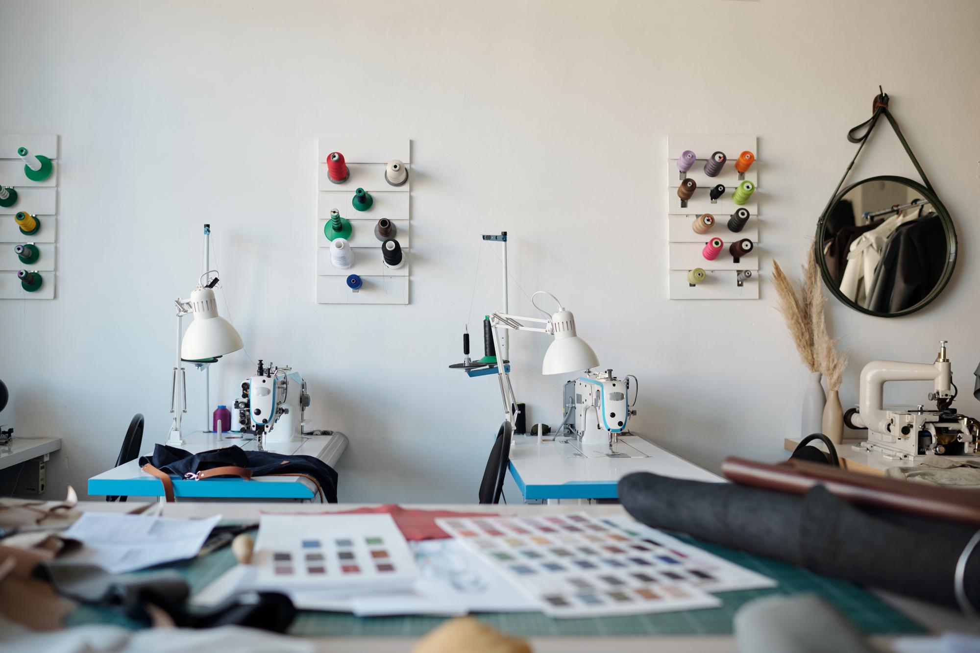 Workshop interior with embroidery machines and samples